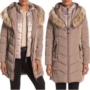 This is a Calvin Klein women's hooded faux-fur- double lined puffer coat.